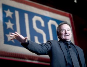 Robin Williams entertains the troops. Photo: Chad J. McNeeley, U.S. Navy. Source: Wikimedia Commons.