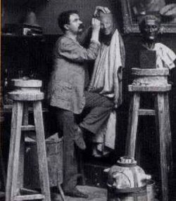 Medardo Rosso in his studio, ca. 1898. Source: Wikimedia Commons.