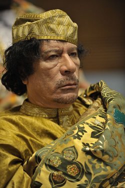 Muammar al-Qaddafi, Brotherly Leader and Guide of the Revolution of Libya. Photo: Jesse B. Awalt, U.S. Navy. Source: Wikimedia Commons.