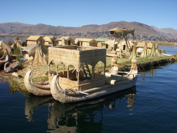 A boat at the Floating Islands, Lake Titicaca, Puno, Peru. Photo: J.P. Duchesneau. Source: Wikimedia Commons.