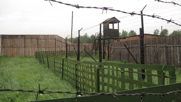 The fence and guard tower at the Soviet forced labor camp Perm-36, part of the Stalin-era prison camp system known as the Gulag.