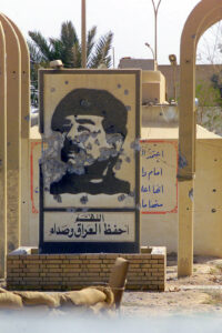 Poster of Saddam Hussein, vandalized